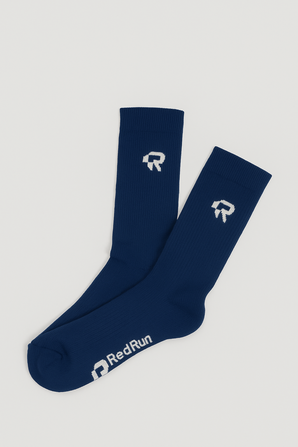 Pair of navy blue socks with a logo and 'RedRun' branding on a light gray background